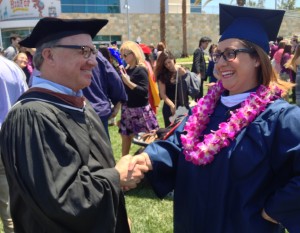 Prof. David Pecoraro congratulates graduate, Ms. Katherine Thornberg.